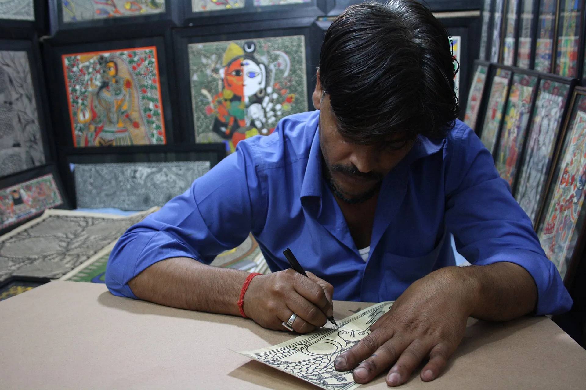 A Madhubani painting artist at Dilli Haat in Delhi.